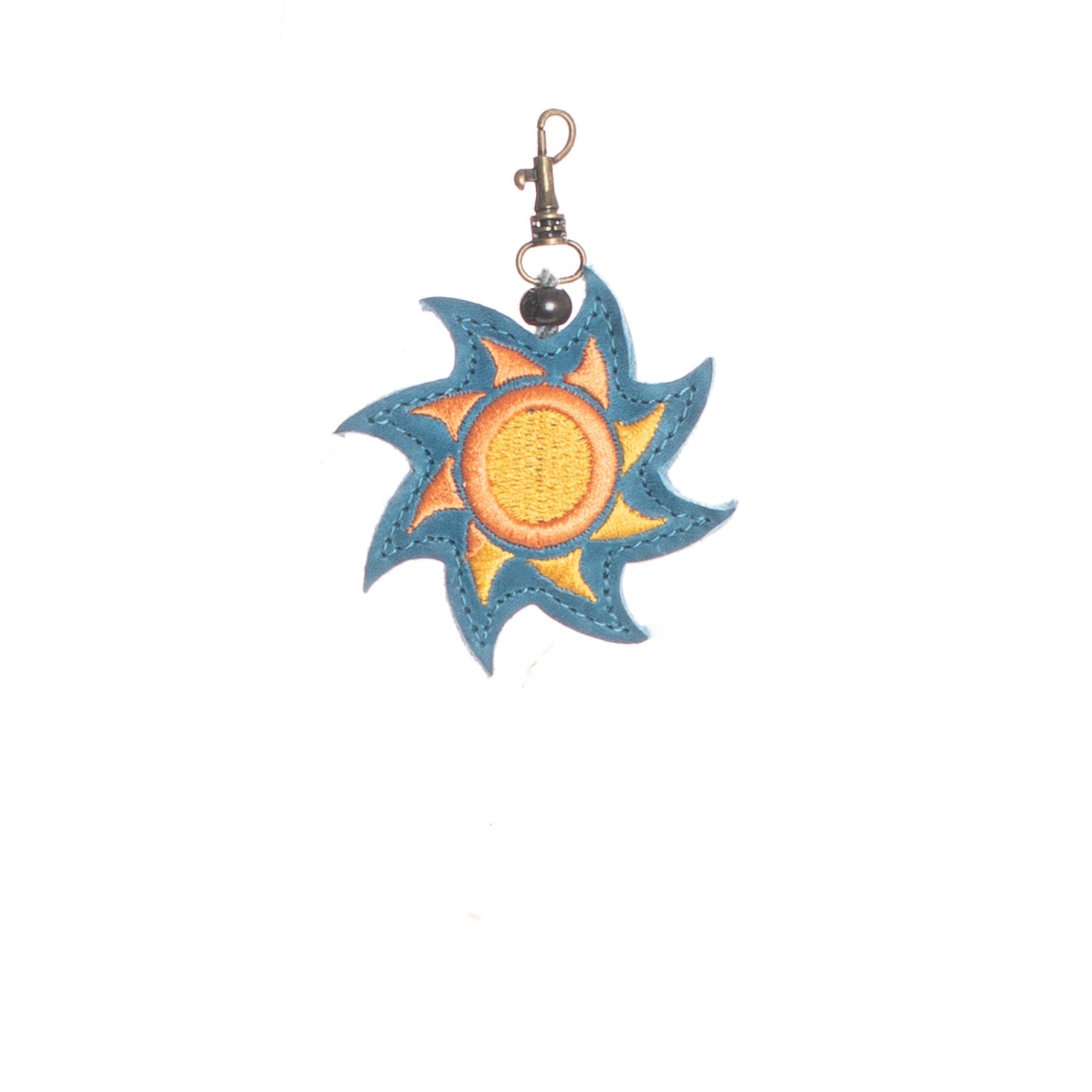 EMBROIDERED SUN CHARM - LEATHER CHARM WITH TASSEL
