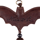 BAT CHARM WITH TASSEL - BARREL BROWN